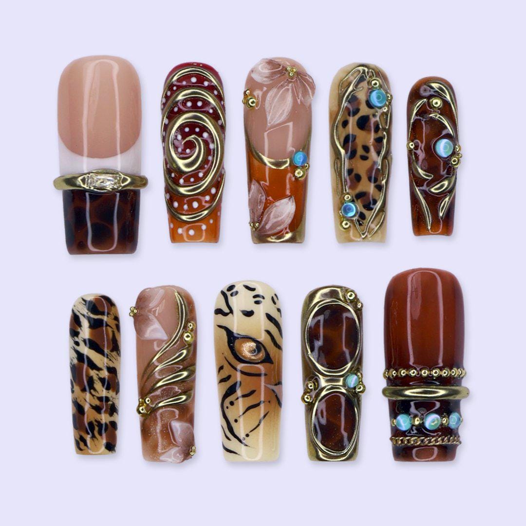 Maximalist Fall Animal Print Nails With Gold Frames and Turquoise Stones