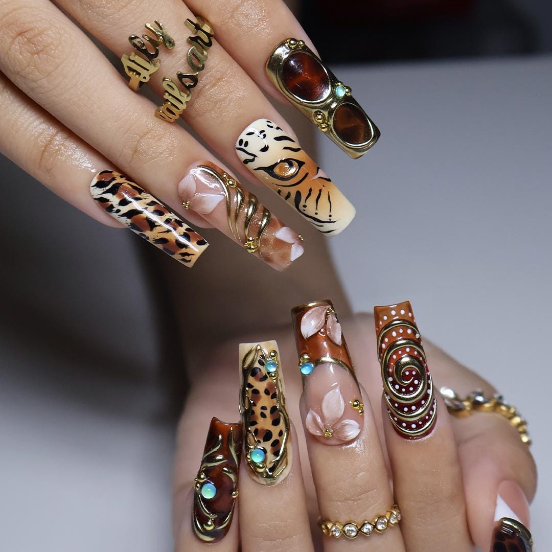 Maximalist Fall Animal Print Nails With Gold Frames and Turquoise Stones