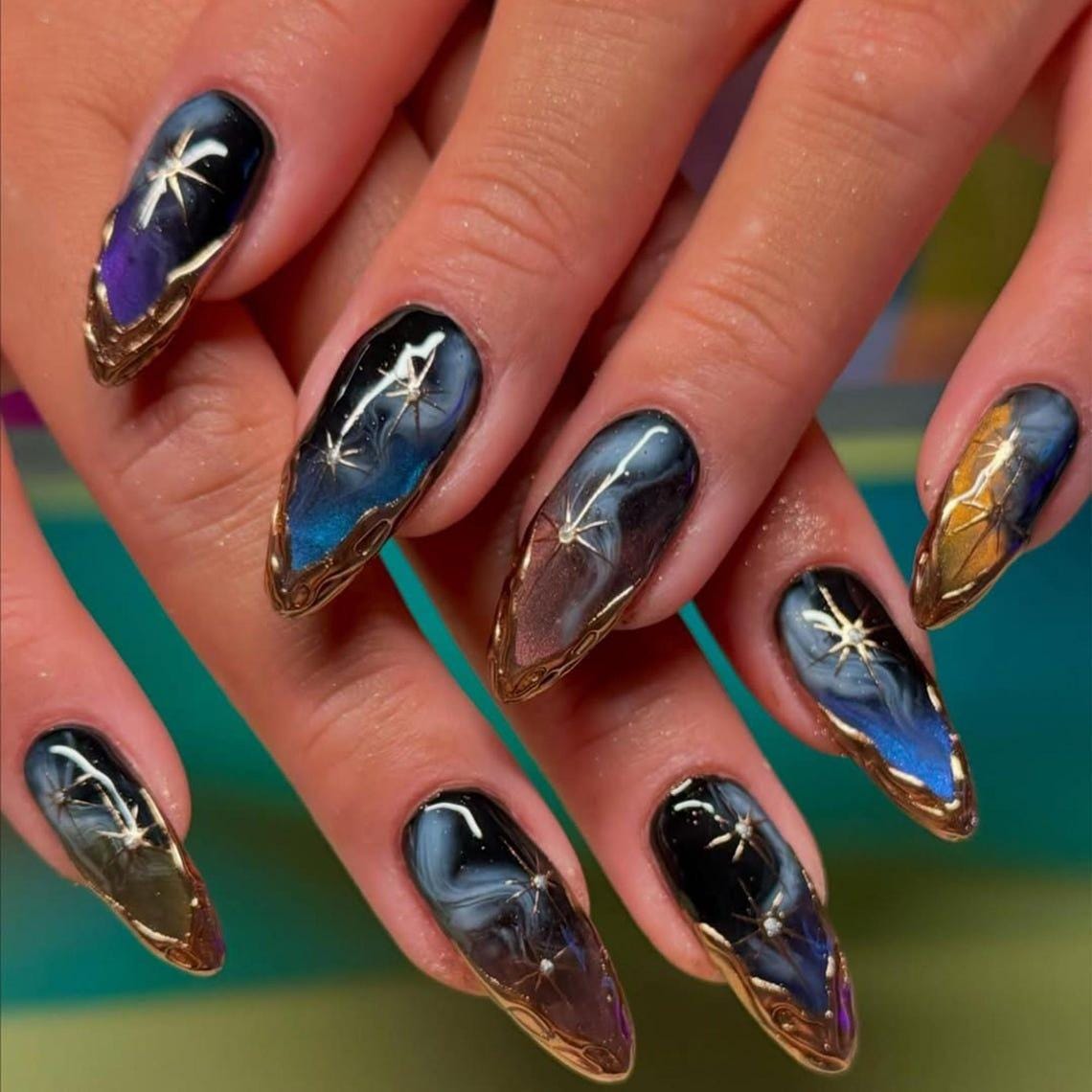 Midnight Galaxy Press-On Nails With Gold Starbursts and Ornate Gold Accents