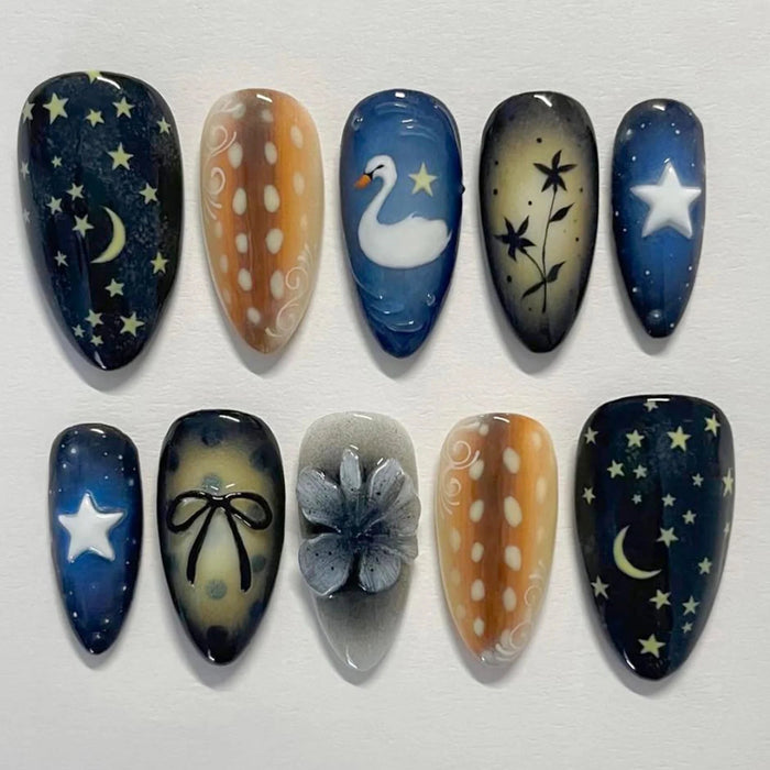 Navy Celestial Press-On Nails with Moon, Stars, Swan, Bow, and Floral Details