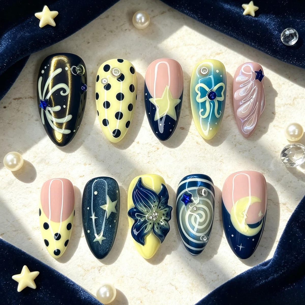 Navy, Pink & Yellow Celestial Nails with Moons, Stars and Blue Flower