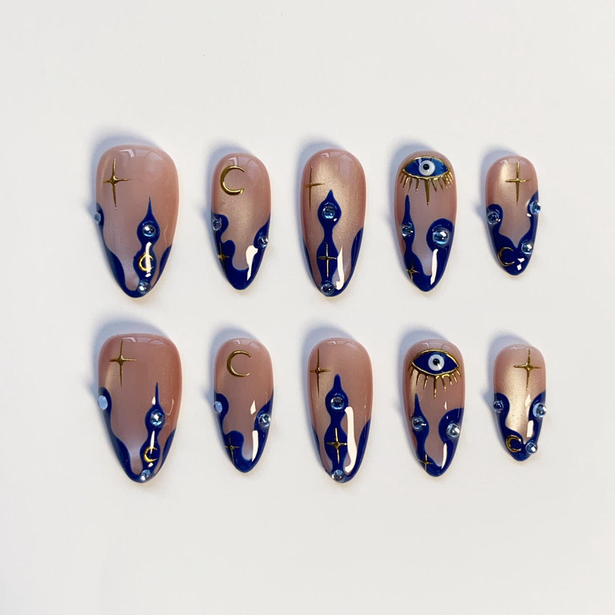 Navy Wavy-Tip Nails With Blue Evil Eyes, Gold Moons and Stars