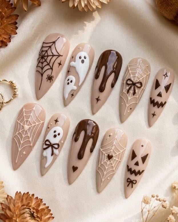 Neutral Brown Halloween Nails With Ghosts, Spiderwebs, Bows, and Jack-O’-Lantern Faces
