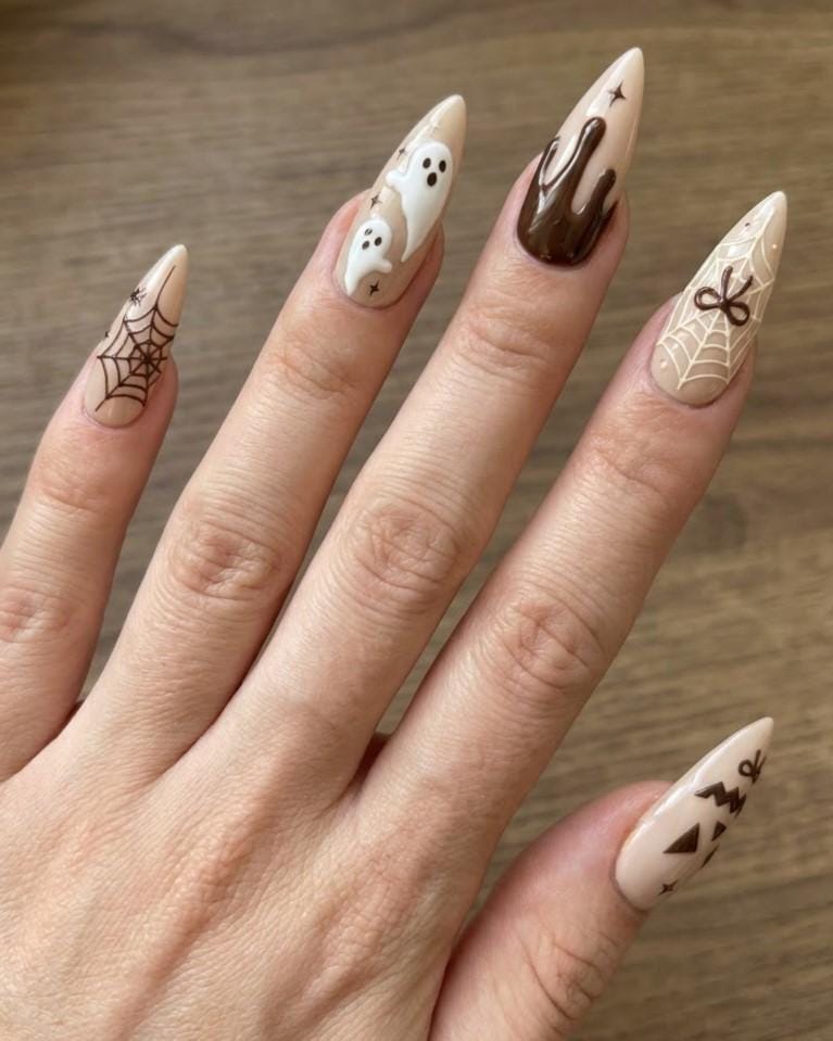 Neutral Brown Halloween Nails With Ghosts, Spiderwebs, Bows, and Jack-O’-Lantern Faces