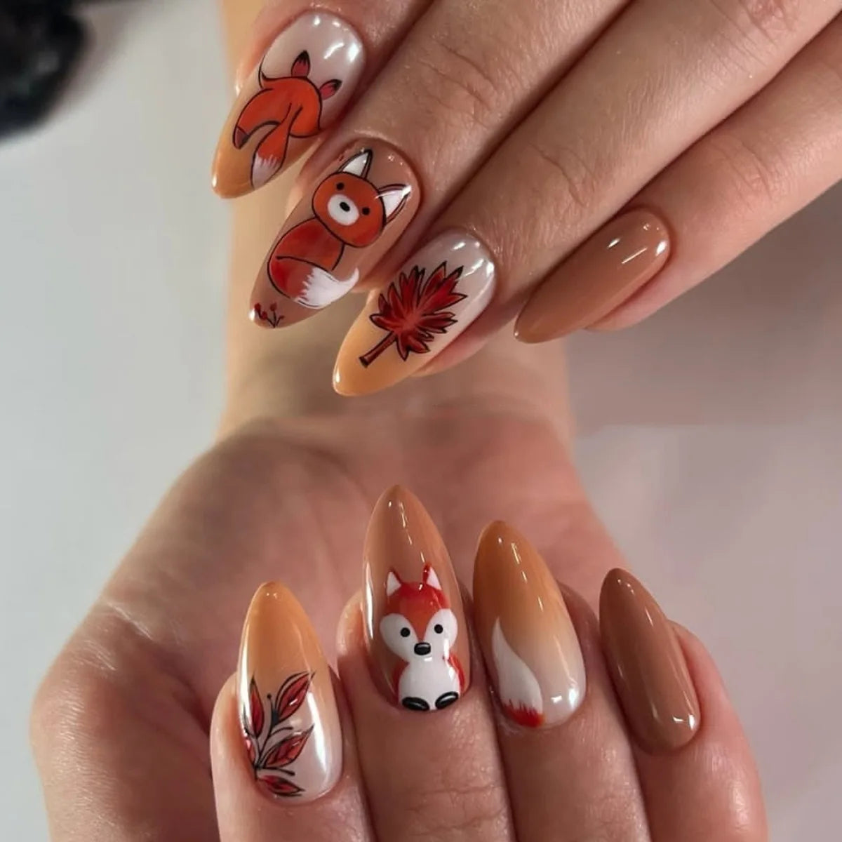 Nude and Caramel Animal Face Nails with Reddish-Brown Leaf Details