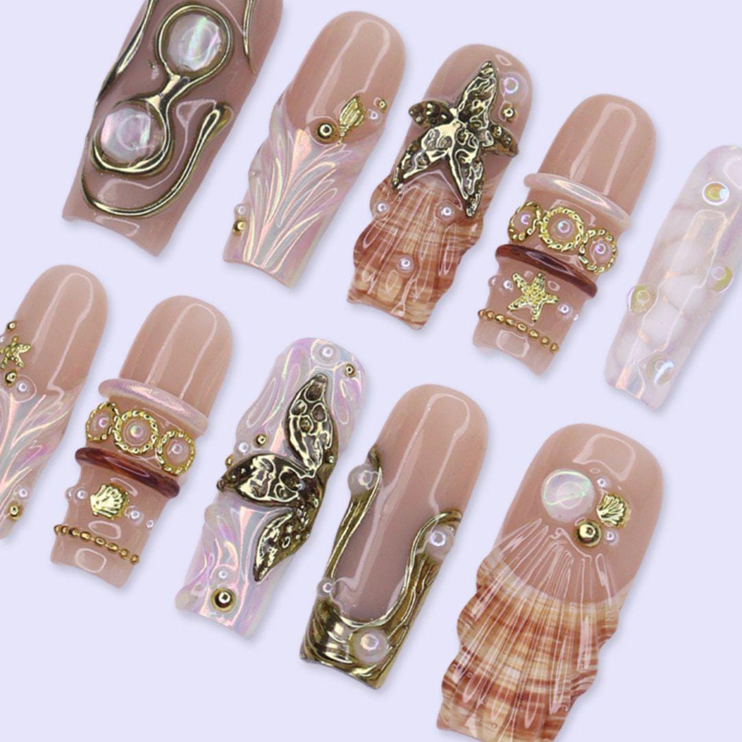 Nude Beige Ocean Nails with Iridescent Shells, Gold Sea-Star Charms and Pearls