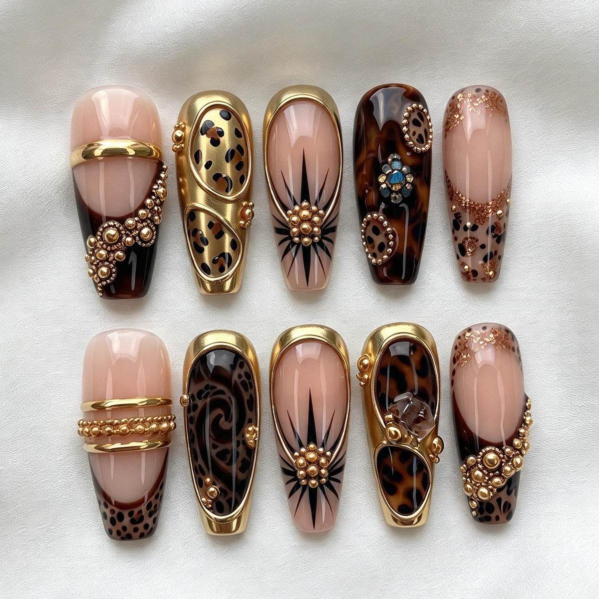 Nude Pink and Tortoiseshell Animal Print Nails with Gold Bands and Jewel Accents