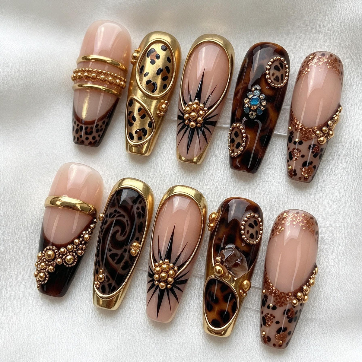 Nude Pink and Tortoiseshell Animal Print Nails with Gold Bands and Jewel Accents