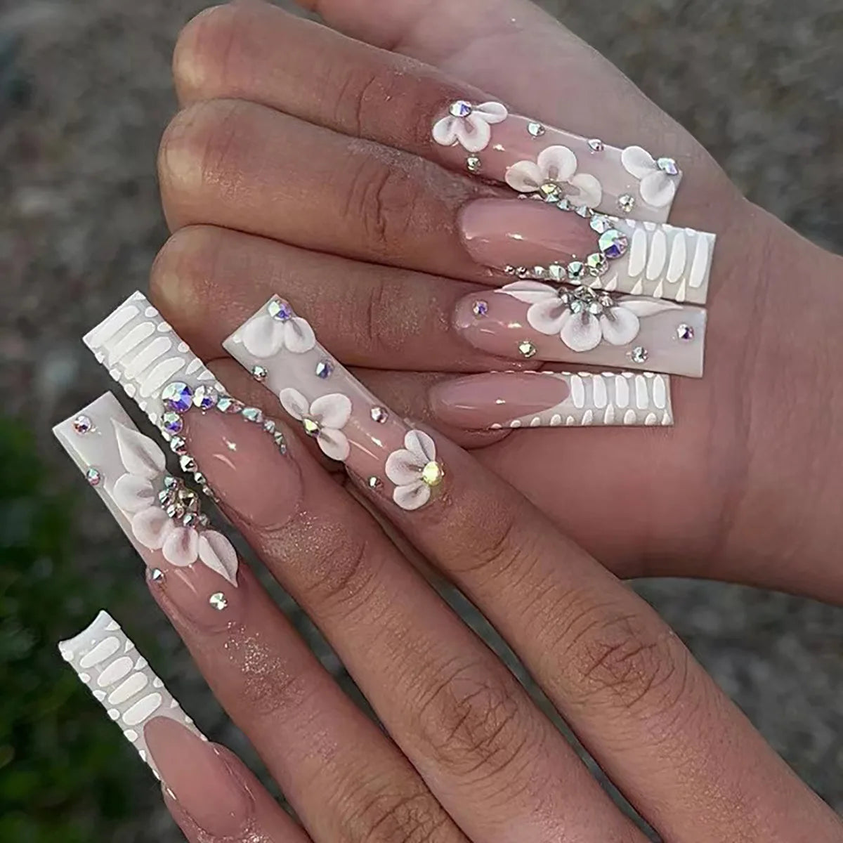 Nude Pink French Tip Nails With 3D White Flowers and Rhinestones