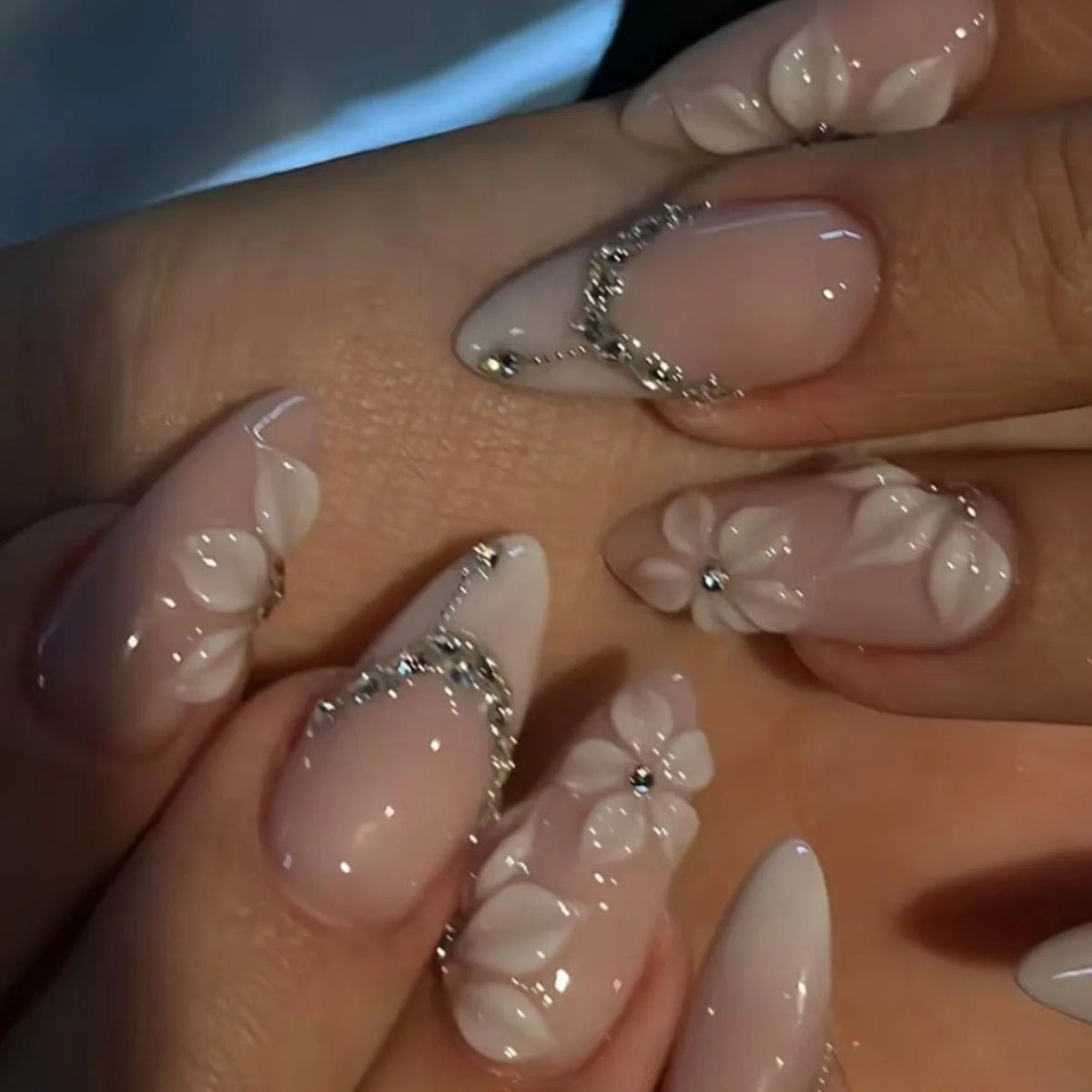 Nude Pink French Tip Nails With 3D White Flowers, Silver Accents and Rhinestones