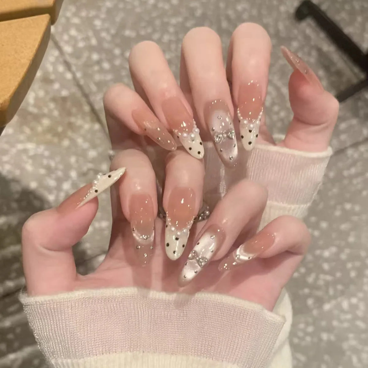 Nude Pink French Tip Nails with Black Polka Dots and Silver Glitter