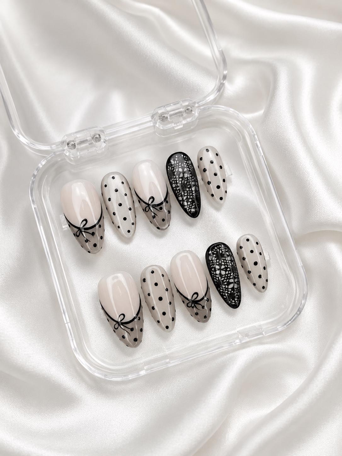 Nude Pink French Tip Nails With Black Polka Dots, Bows, and Lace Details