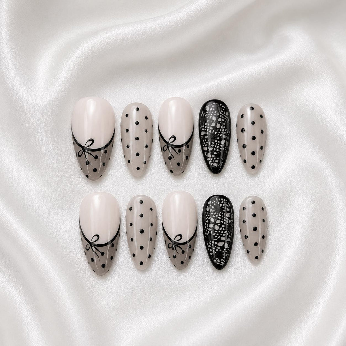 Nude Pink French Tip Nails With Black Polka Dots, Bows, and Lace Details
