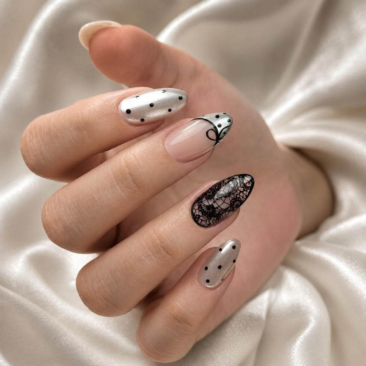 Nude Pink French Tip Nails With Black Polka Dots, Bows, and Lace Details