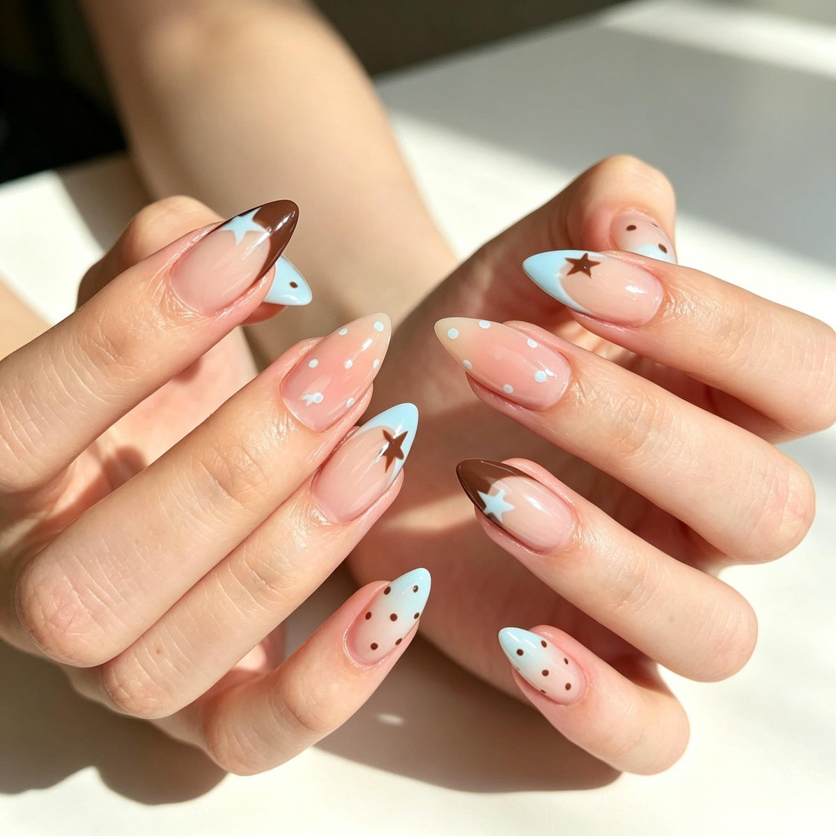 Nude Pink French Tip Nails With Blue and Brown Stars and Polka Dots