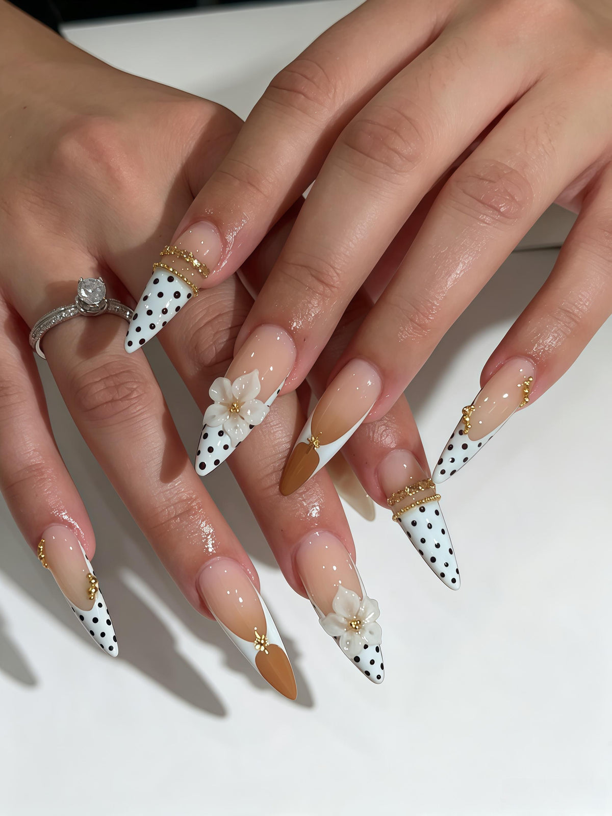Nude Pink Polka Dot French Tip Nails with 3D White Flowers and Gold Accents
