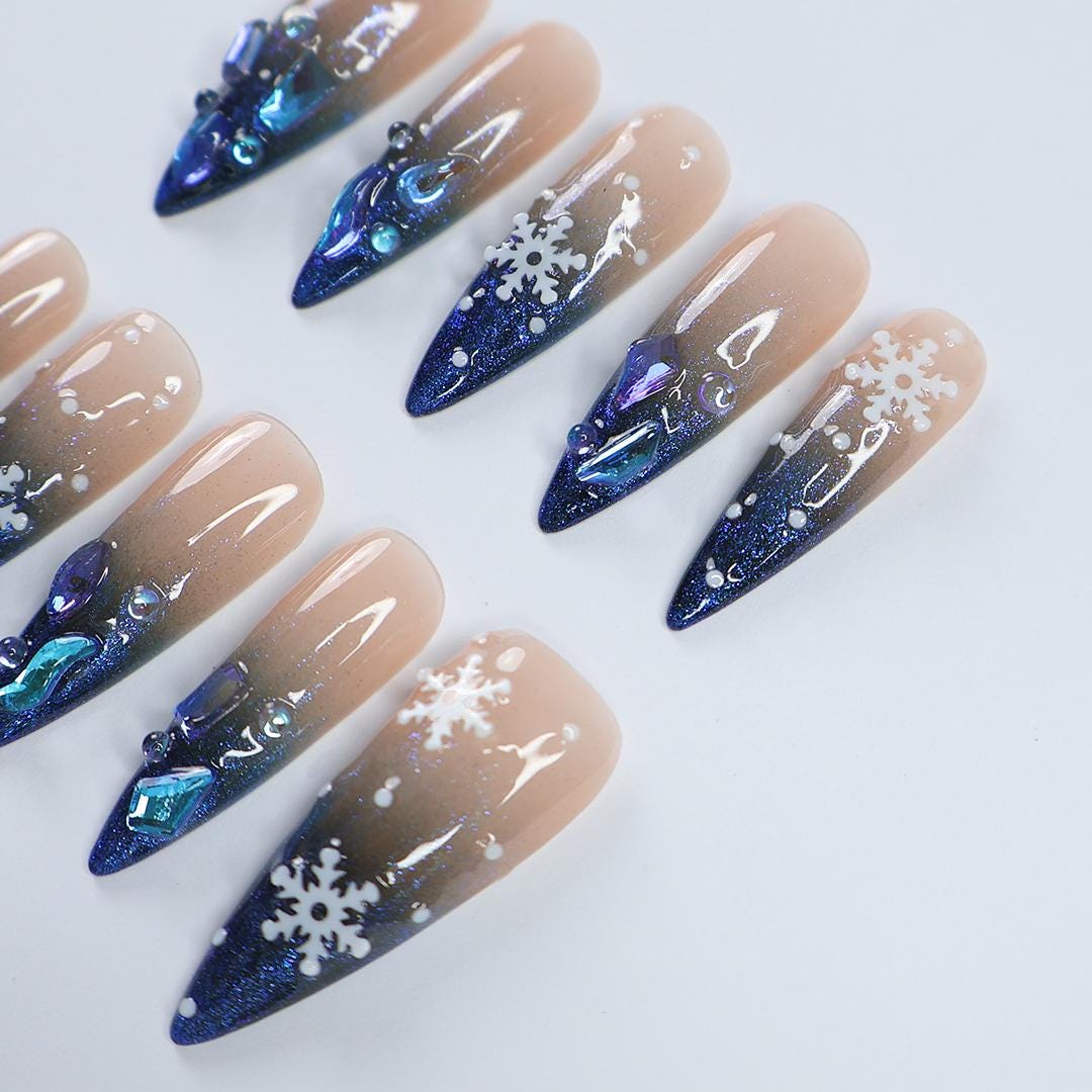 Nude-to-Navy Christmas Snowflake Press-On Nails With Blue Gems