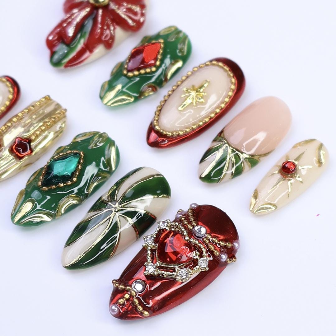 Ornate Christmas Press-On Nails With Red Bow, Emerald Gems and Gold Starbursts