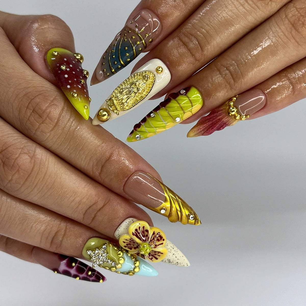 Ornate Green and Burgundy Floral Nails with Gold Details