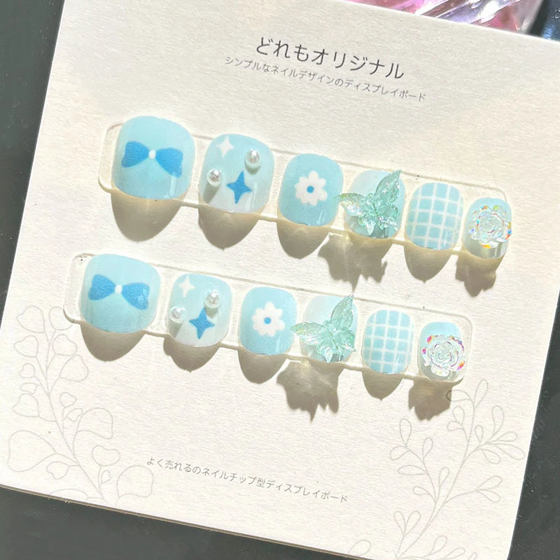 Pale Aqua and White Bow, Flower, and Butterfly Nail Set