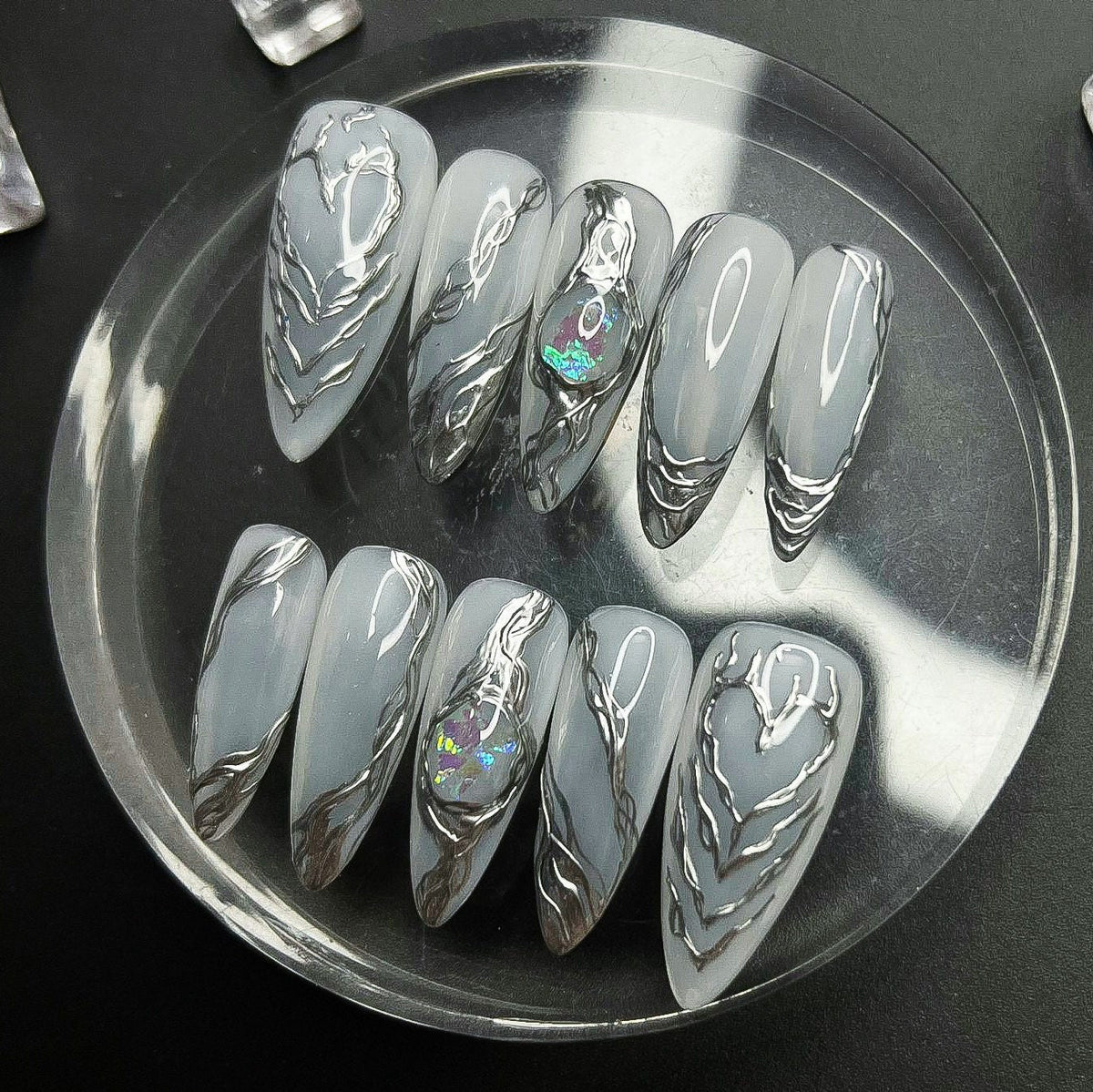 Pale Gray Nails With Sculpted Silver Chrome Tips
