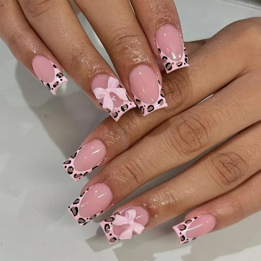 Pale Pink French Tip Nails with Black Spots and 3D Bows