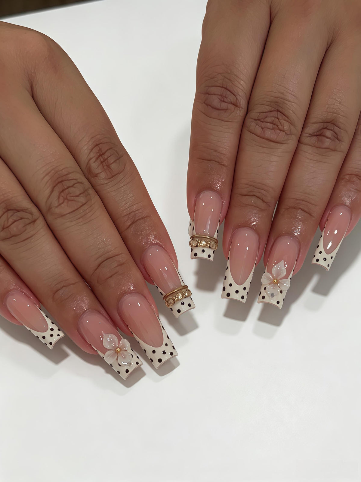 Pale Pink Polka Dot French Tip Nails with 3D Flowers and Gold Accents