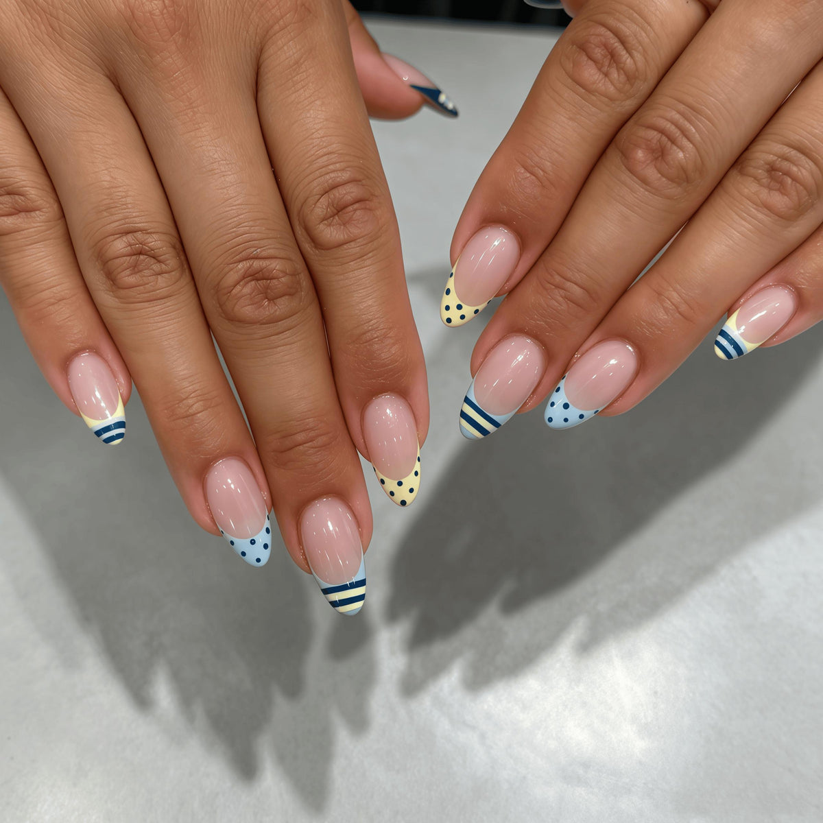 Pastel Blue and Yellow French Tip Nails with Navy Dots and Stripes
