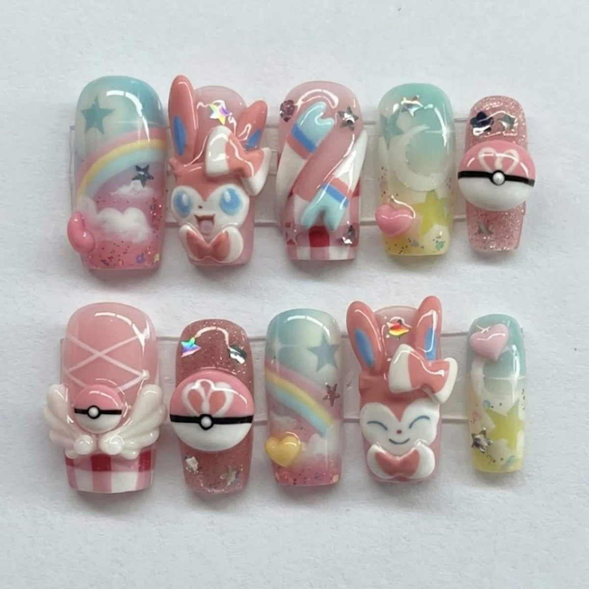 Pastel Character Press-On Nails with 3D Figures, Rainbows, Stars, and Poké Ball Details