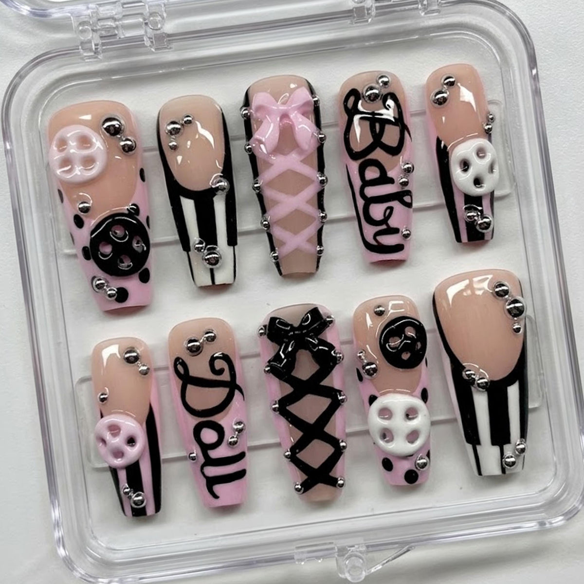 Pink and Black Coquette Corset Nails with Bows, Buttons, and Stripes