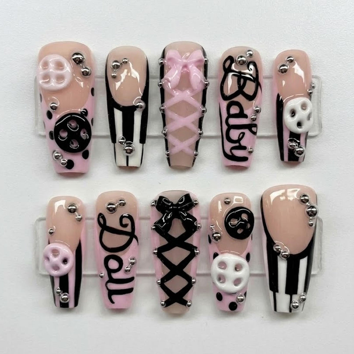 Pink and Black Coquette Corset Nails with Bows, Buttons, and Stripes