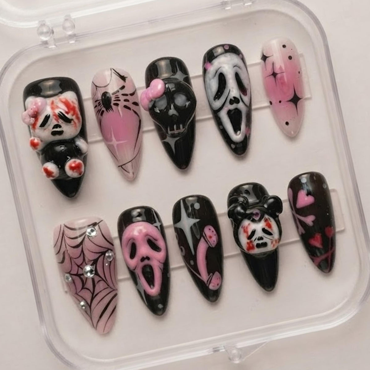 Pink and Black Gothic Halloween Nails With Horror Masks, Skulls, Spiderwebs, and Bows