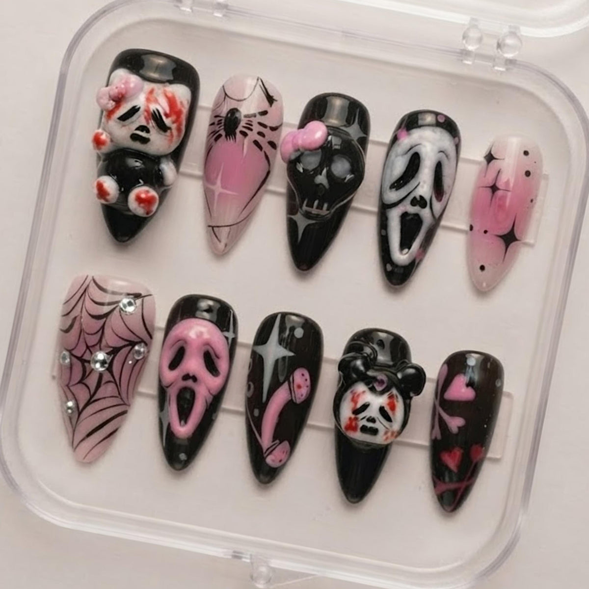 Pink and Black Gothic Halloween Nails With Horror Masks, Skulls, Spiderwebs, and Bows