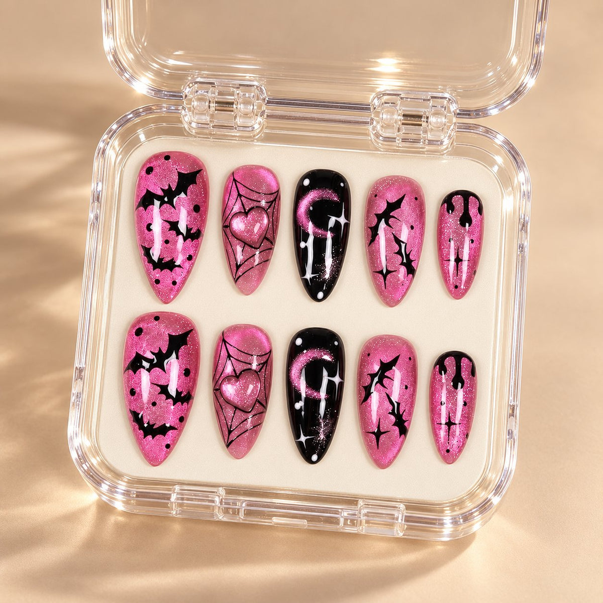 Pink and Black Halloween Bat Nails With Heart, Moon, and Spider Web Art in clear acrylic storage box