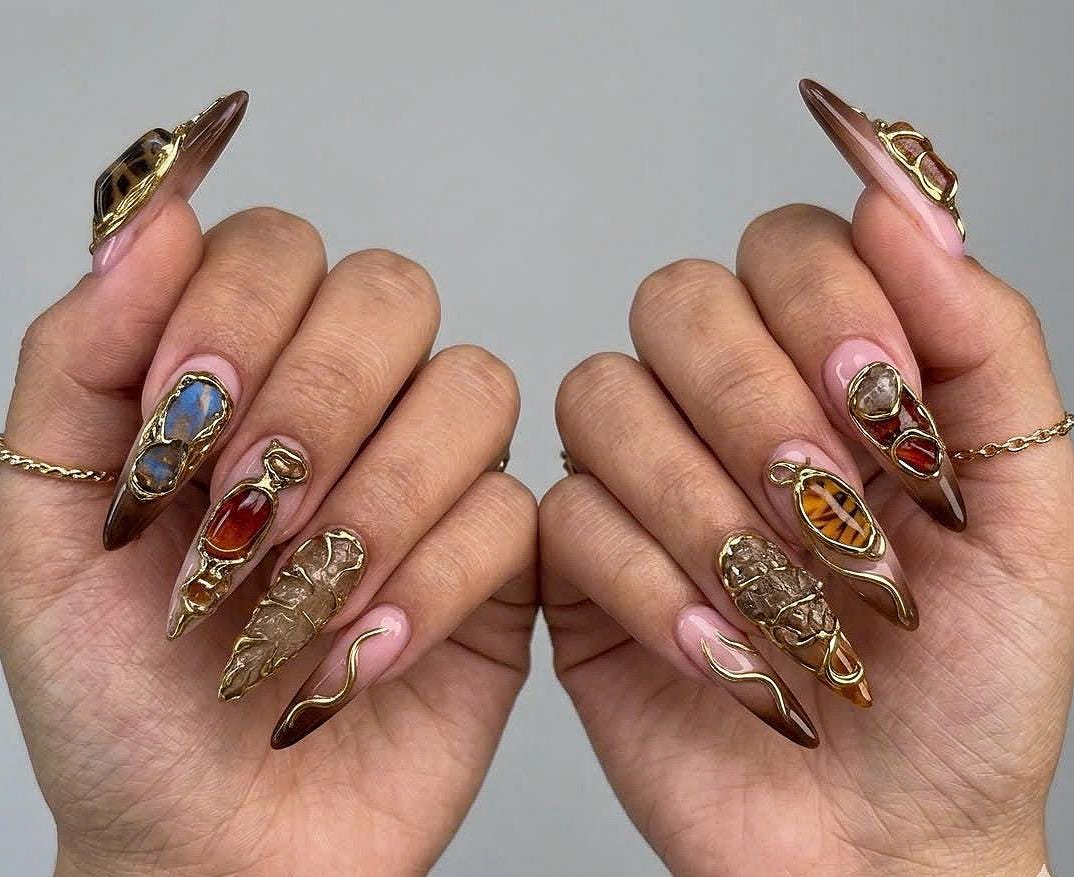 Pink and Deep Brown Stiletto Nails with Gold Filigree and Gemstone Details