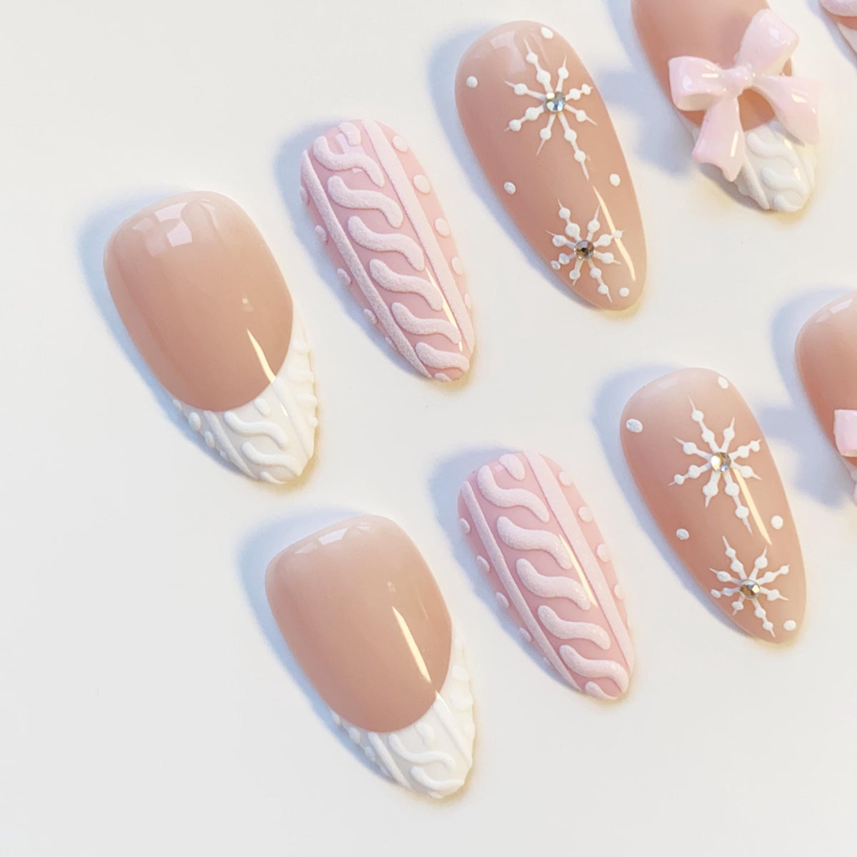 Pink and Nude-Taupe Christmas Winter Nails With Sweater Texture, Snowflakes, and Bows