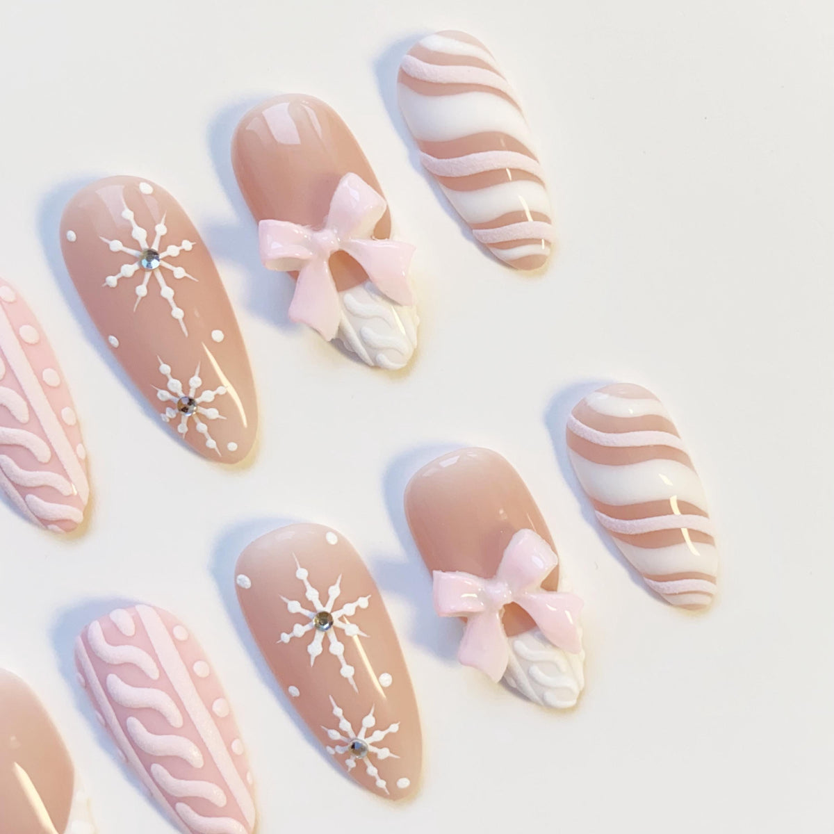 Pink and Nude-Taupe Christmas Winter Nails With Sweater Texture, Snowflakes, and Bows