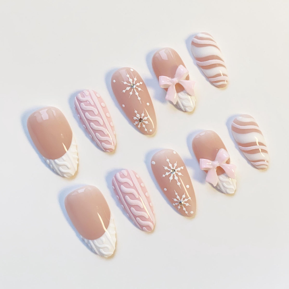 Pink and Nude-Taupe Christmas Winter Nails With Sweater Texture, Snowflakes, and Bows