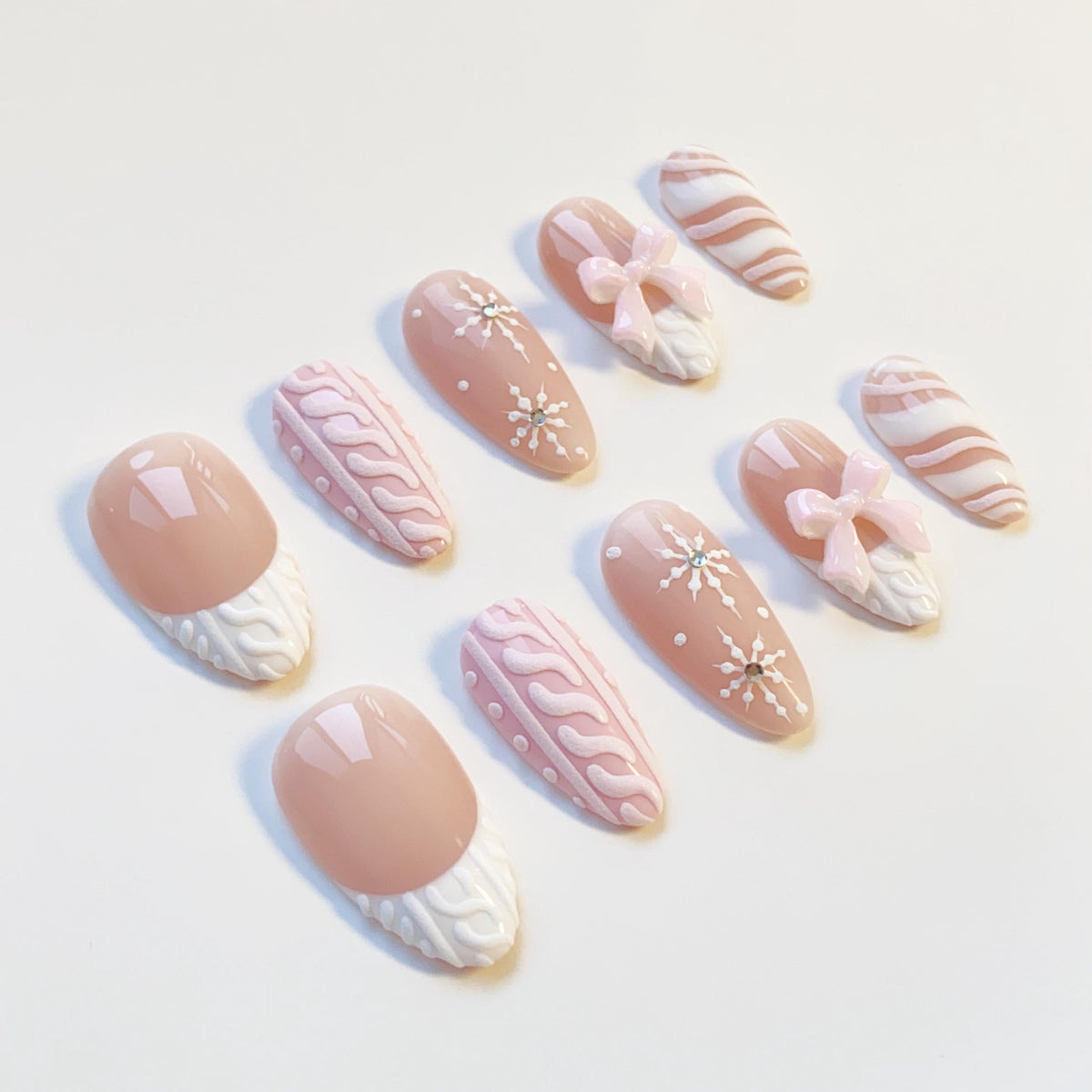 Pink and Nude-Taupe Christmas Winter Nails With Sweater Texture, Snowflakes, and Bows