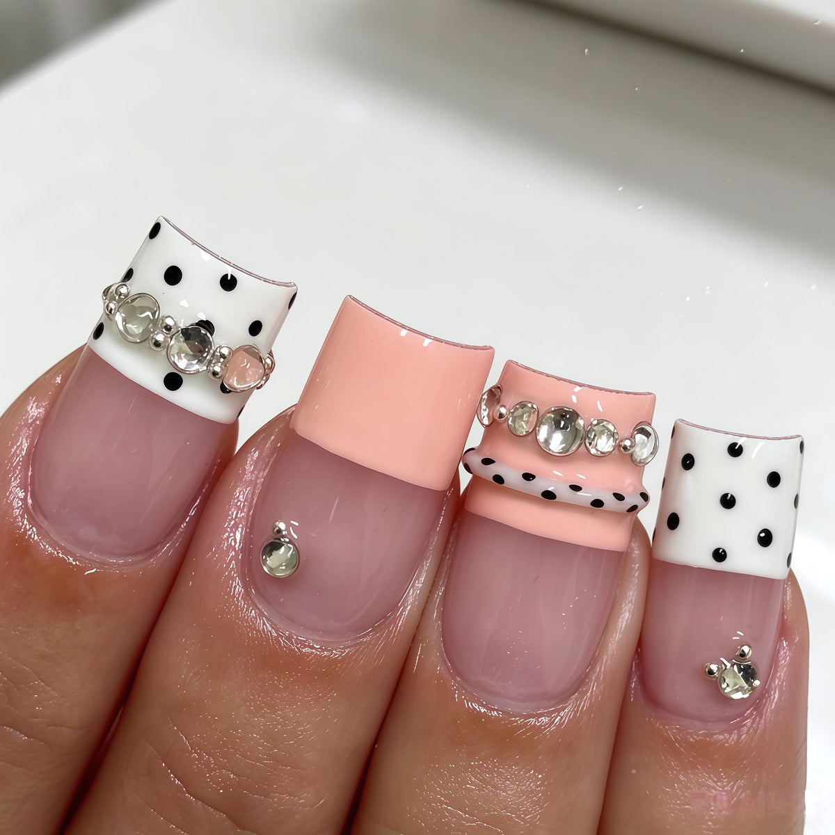 Pink and White Polka Dot French Tip Nails with Rhinestone Chains