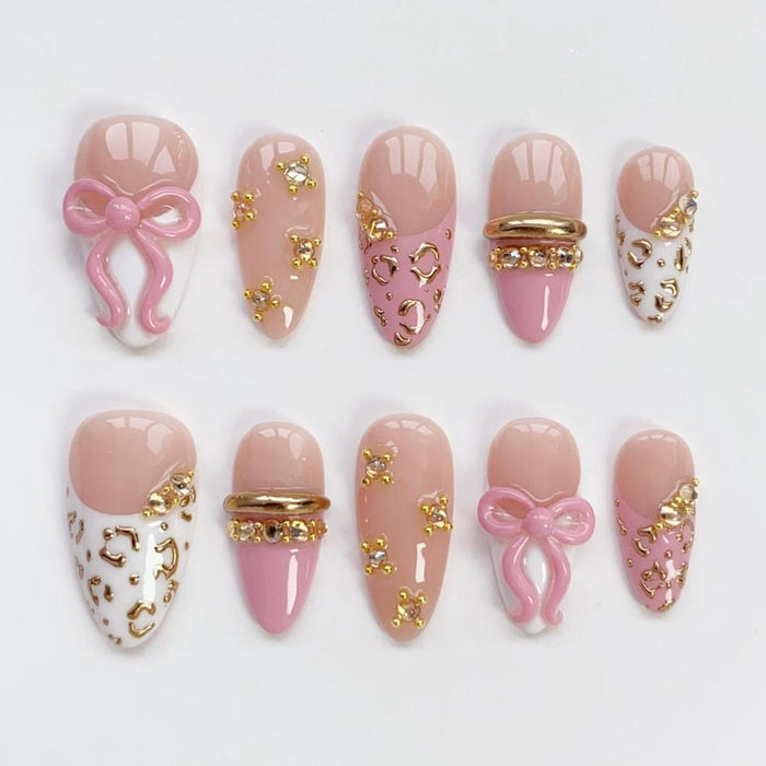Pink Bow Birthday Press On Nail Set With Gold Leopard Spots, French Tips, and Rhinestones