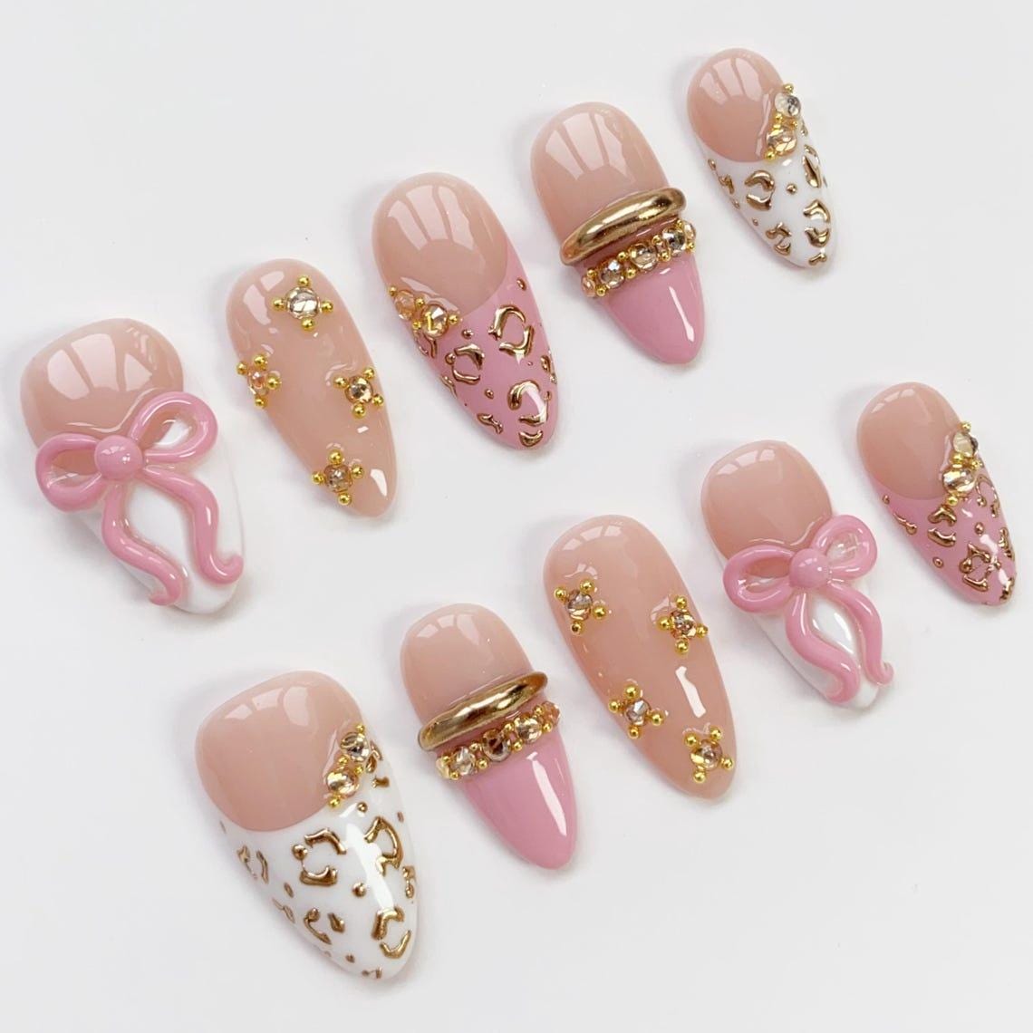 Pink Bow Birthday Nail Set With Gold Leopard Spots, French Tips, and Rhinestones