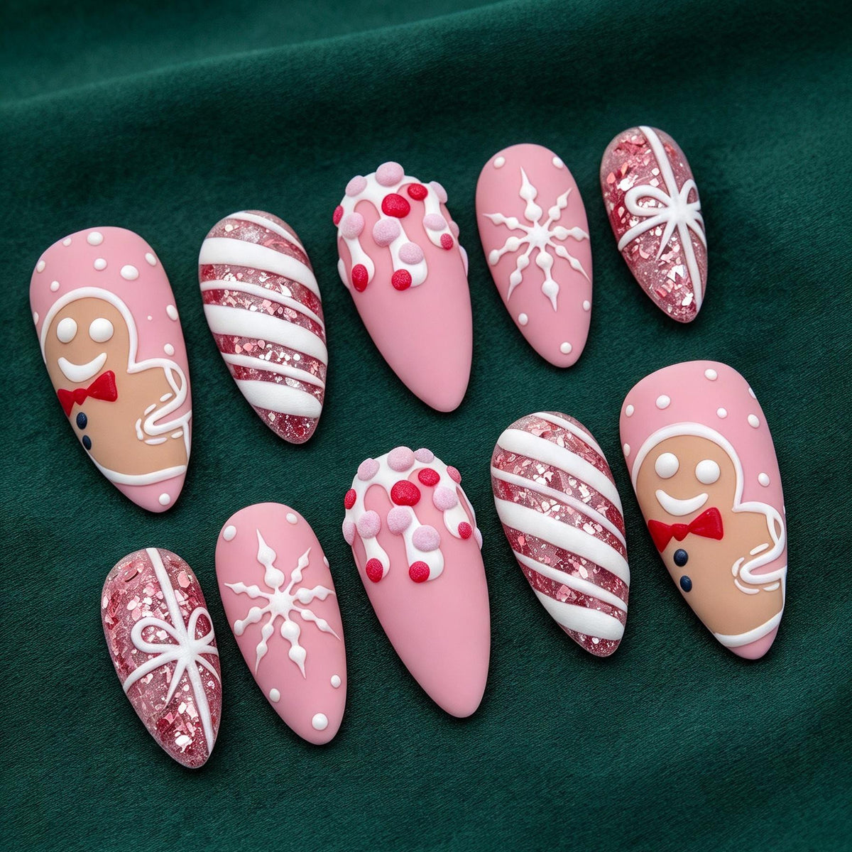 Pink Christmas Nails With Gingerbread, Snowflakes, Candy Stripes, and Glitter Bows