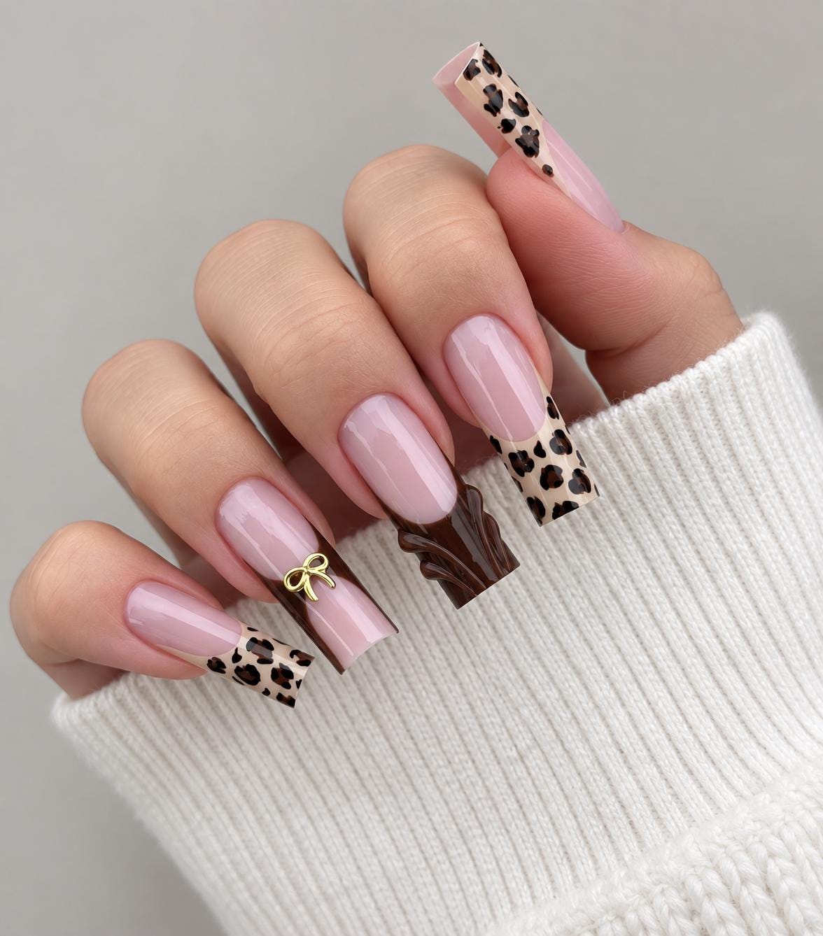 Pink Nude Animal Print Tip Nails With Brown Accent and Gold Bow Charm for Fall and Winter