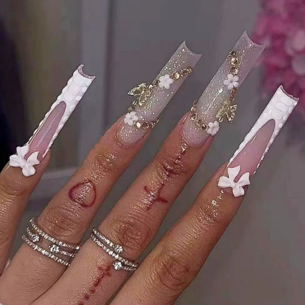 Pink Nude French Tip Nails With 3D White Bows, Flowers and Gold Details