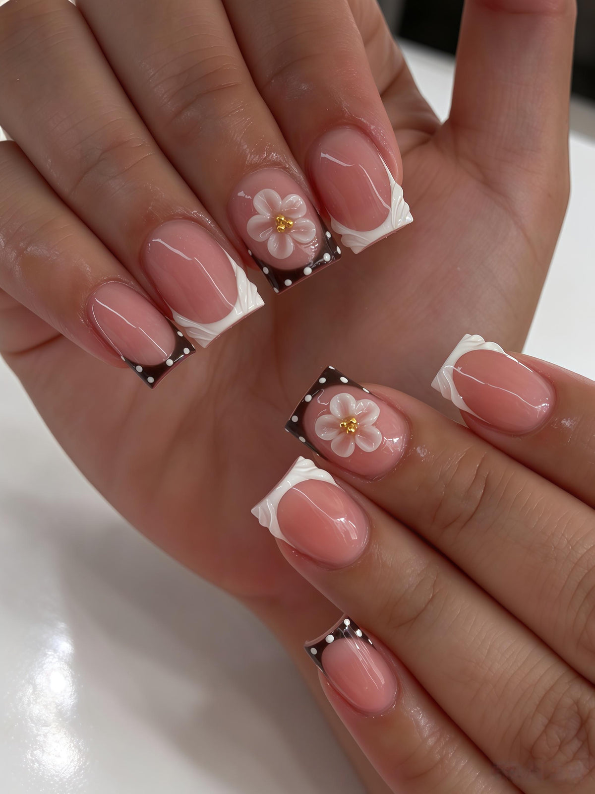 Pink Nude French Tip Nails With Brown Polka Dots and 3D White Flowers