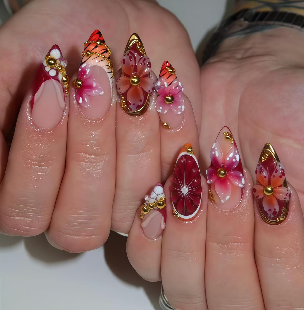 Pink Tropical Flower Press-On Nails With Red Tips and Gold Chain Details