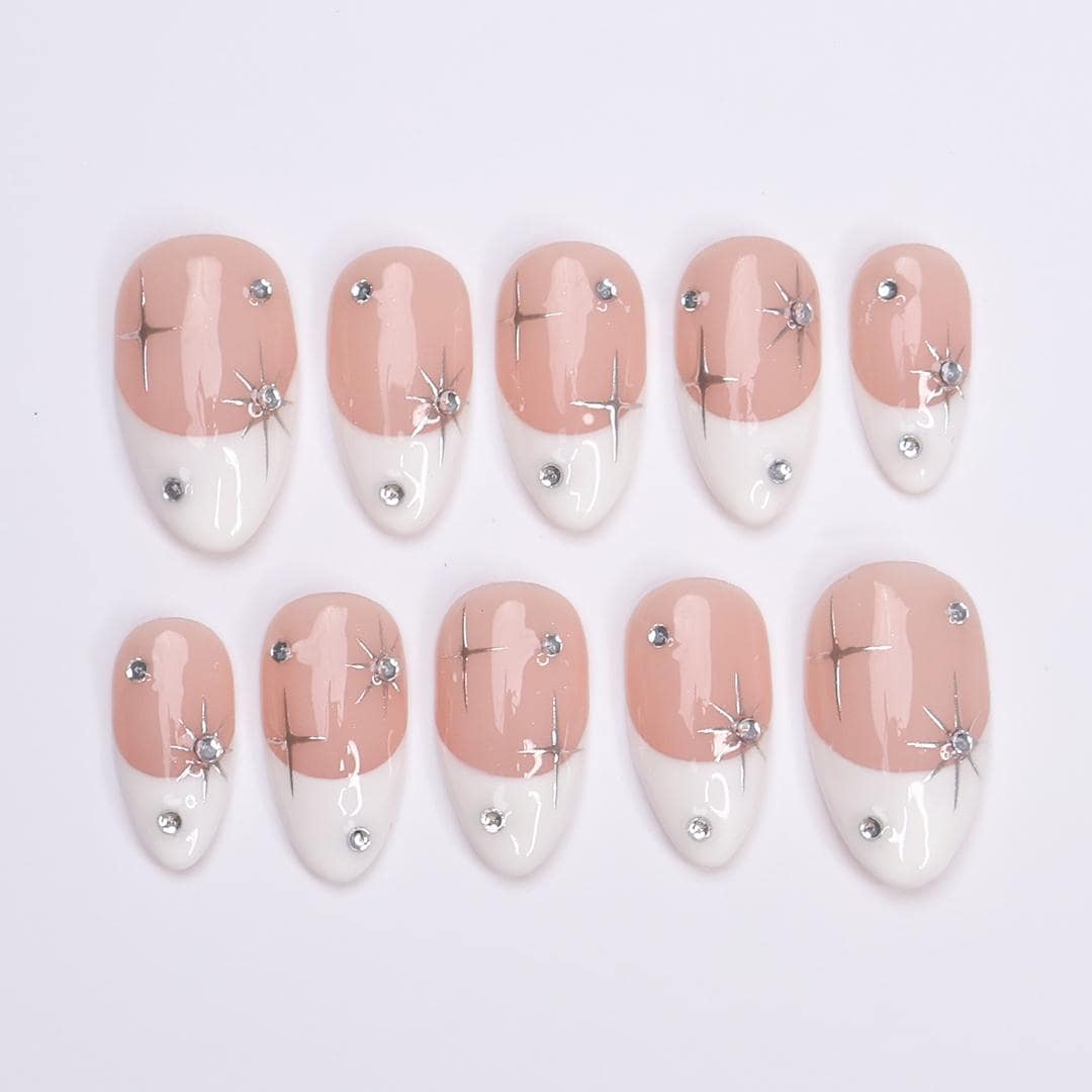 Blush Pink French Tip Nails with Silver Stars and Rhinestone Accents