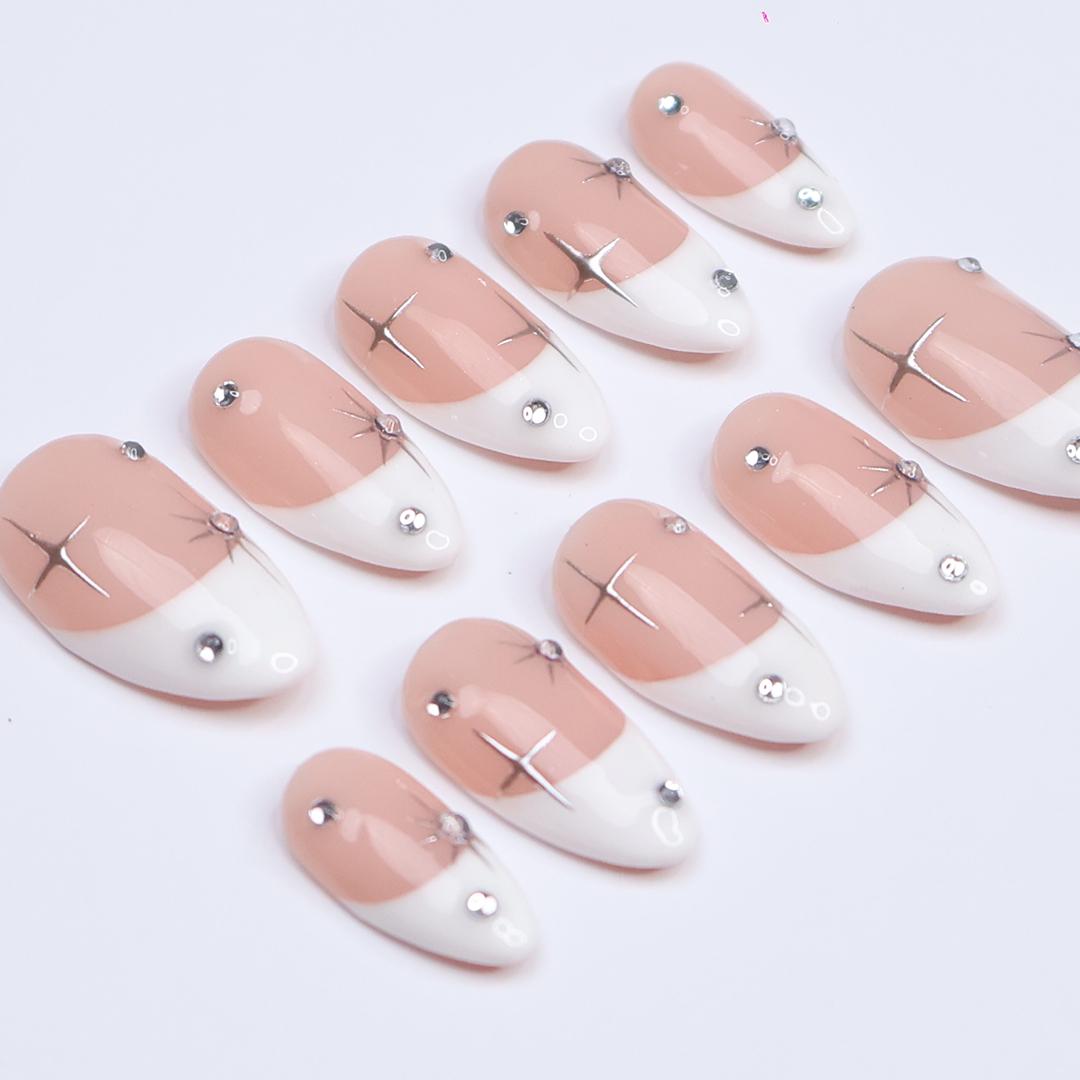 Blush Pink French Tip Nails with Silver Stars and Rhinestone Accents