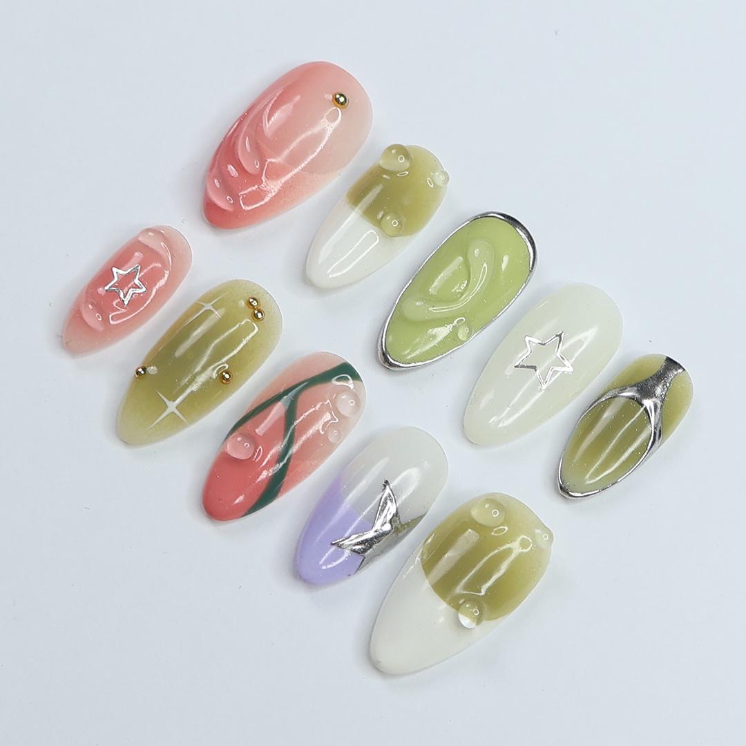 Coral Pink and Green Y2K Nails with Bubble Accents and Silver Stars